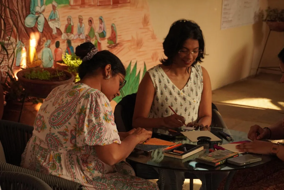 People painting together at a workshop