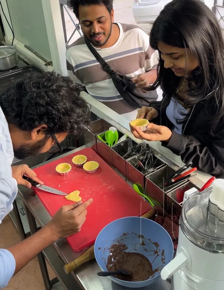Friends cooking together at a workshop